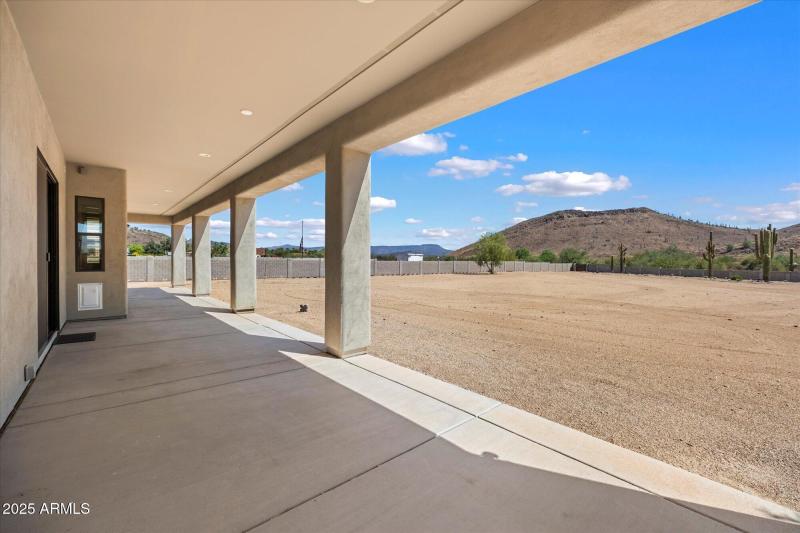 Long covered patio in back