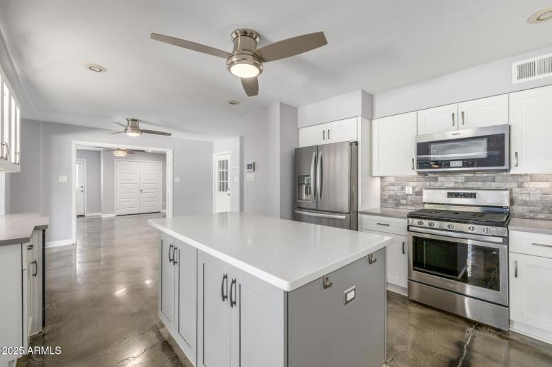 Kitchen with view of Den:office with ac