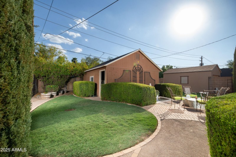 Backyard w/ walkways to patio