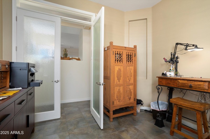 ENCLOSED DEN/OFFICE WITH PRIVACY DOORS.