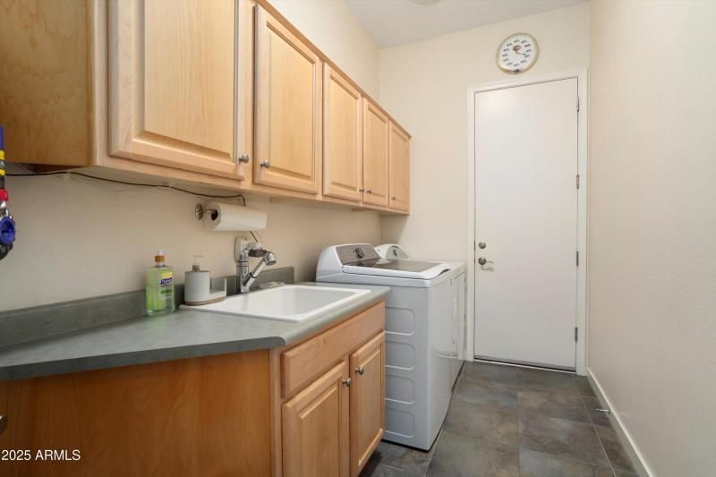 LAUNDRY UPGRADED WITH CABINETS & SINK.