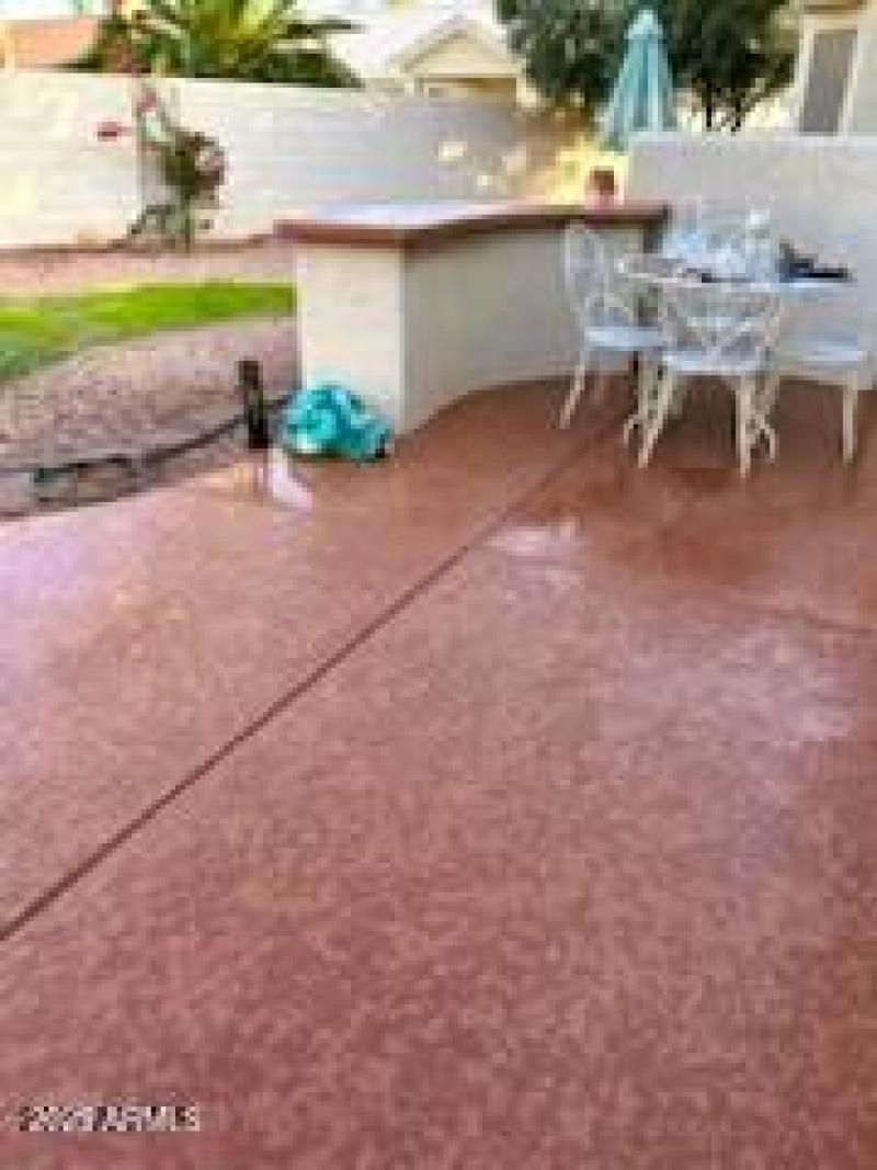 Back yard cool-dek patio and grass