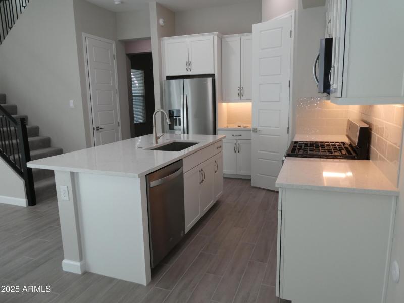 stainless fridge.granite counters
