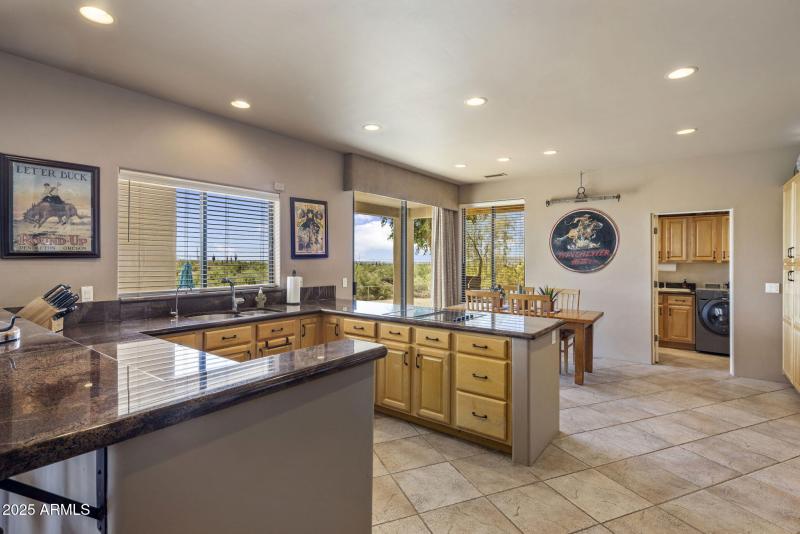 Eat-in kitchen towards laundry