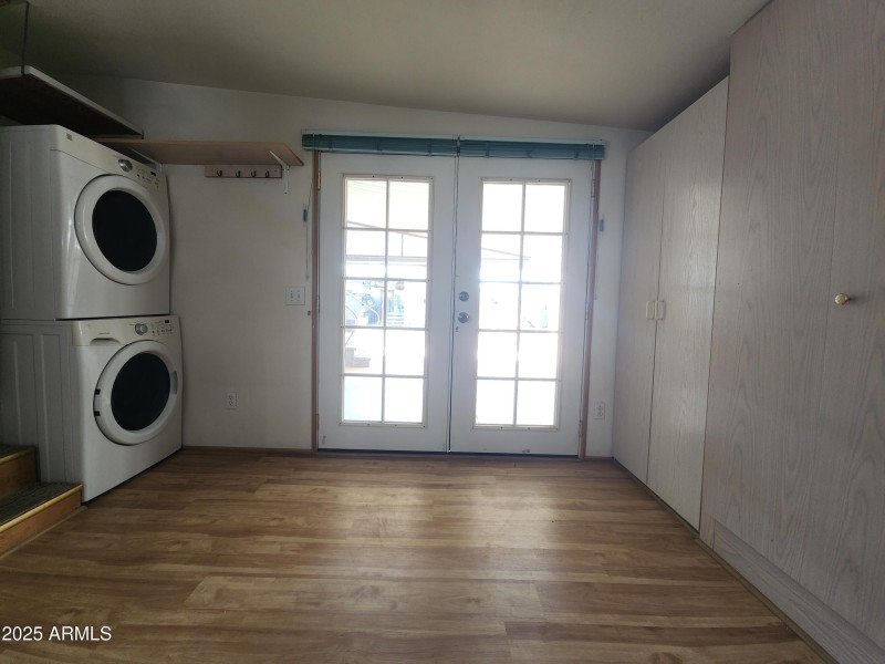 54. Stack Washer and dryer in AZ room.