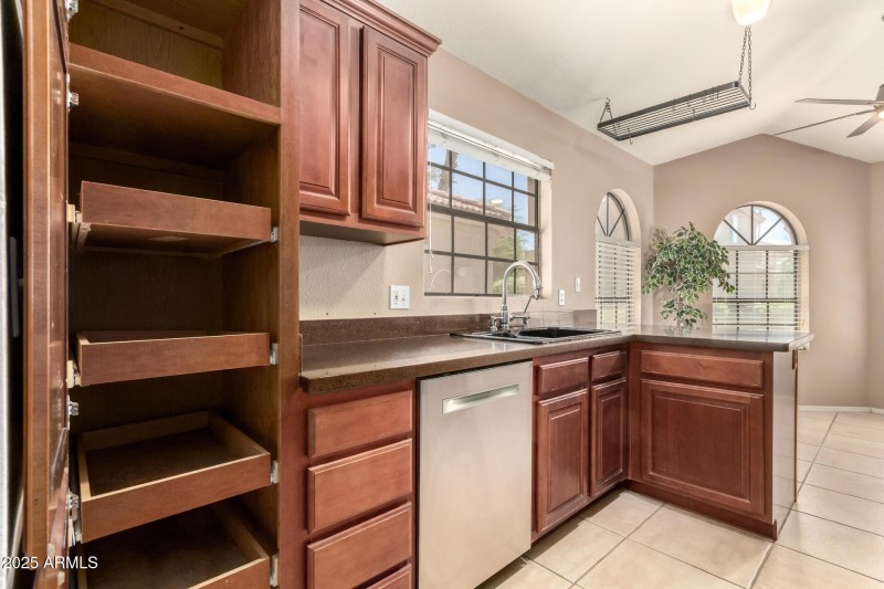 KITCHEN HAS CONVENIENT PULL-OUT DRAWERS