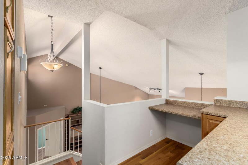 OFFICE LOFT OVERLOOKS LIVING ROOM