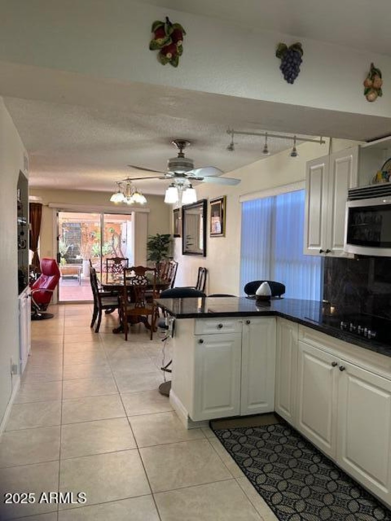 Kitchen view to dining area and slider t