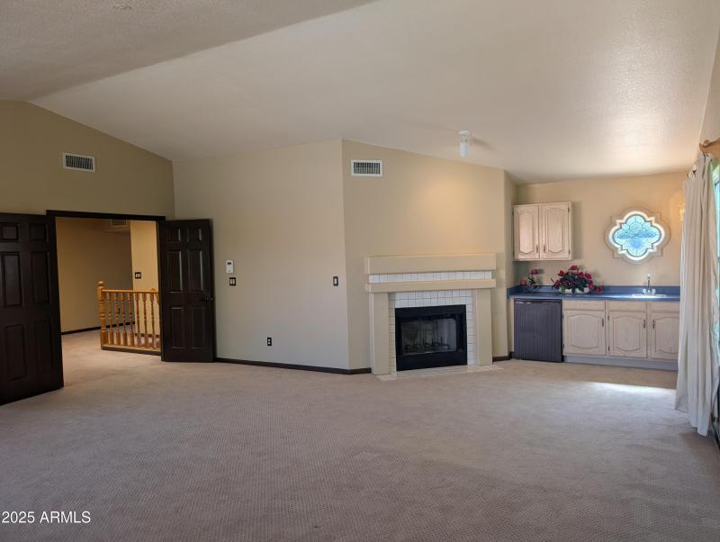 12 Primary bedroom with FP and wetbar