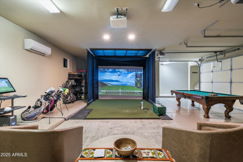 golf sim and game room in garage