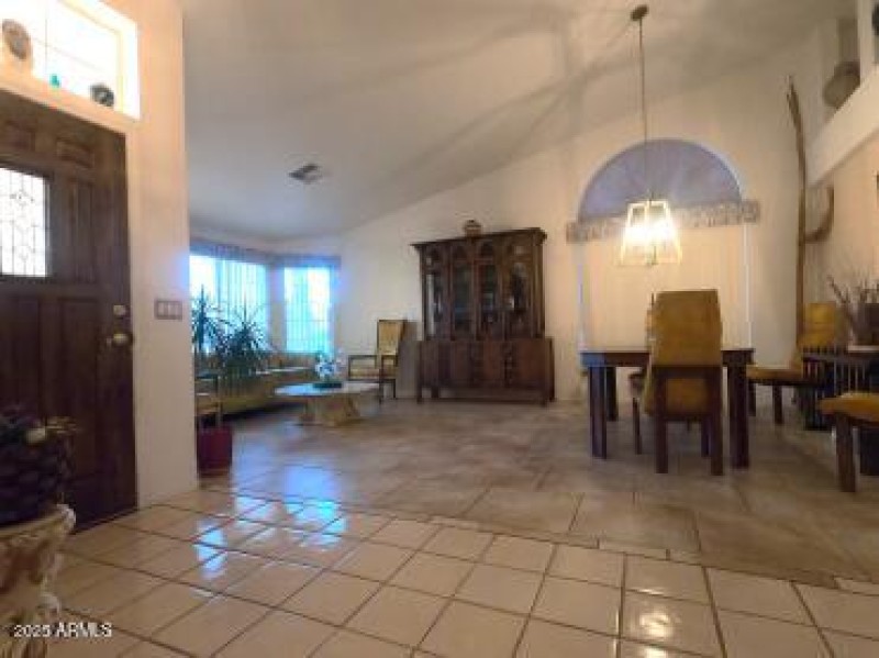 Entry, formal living and dining rooms