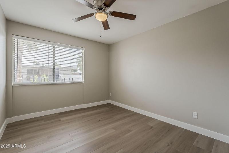 Bright Bedroom with Updated Flooring