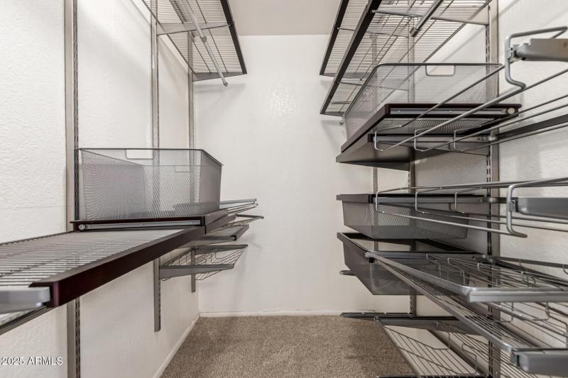 Primary Walk-In Closet w/ custom shelves