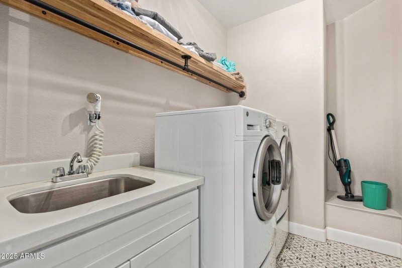 Downstairs laundry room is large