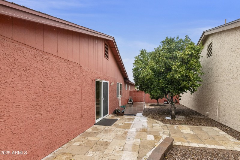 Side patio with travertine