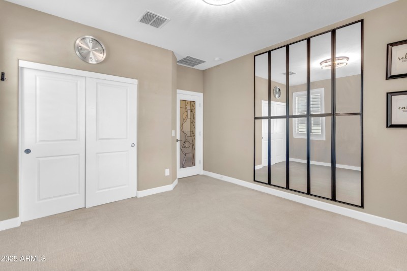 Mirrors Highlight this Secondary Bedroom