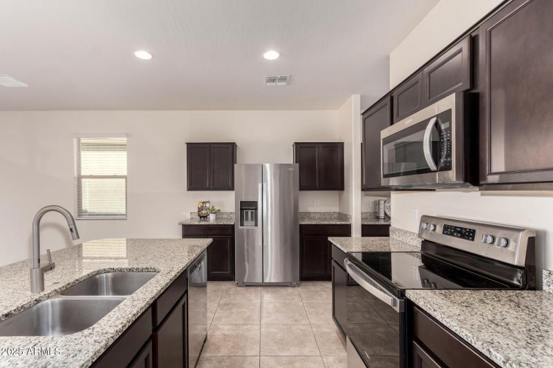 Spacious Kitchen With Espresso Cabinets