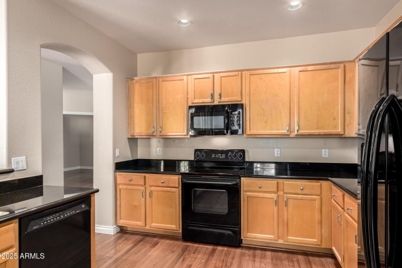 “Kitchen w/ Granite Counters”