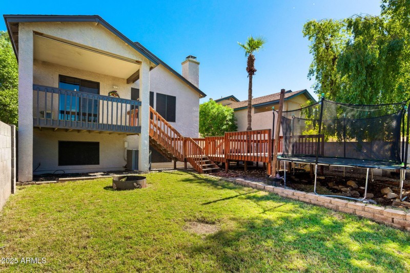 Large Backyard with deck and tramploine