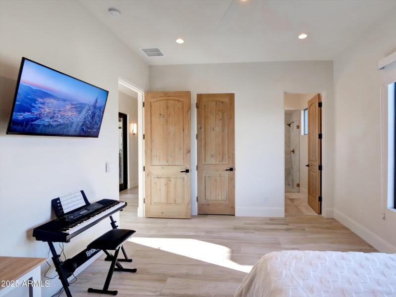 Guest bedroom with walk in closets