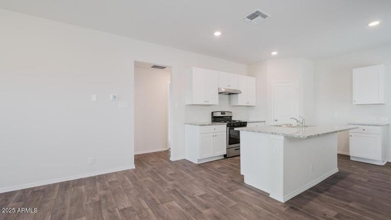 Amber kitchen and hallway to bedrooms