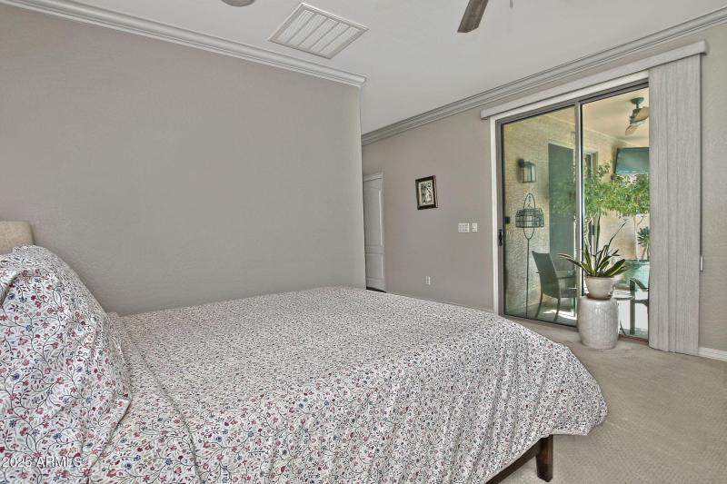 Door to back patio from primary bedroom