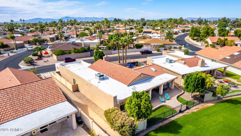 Rear aerial showing back patio and green