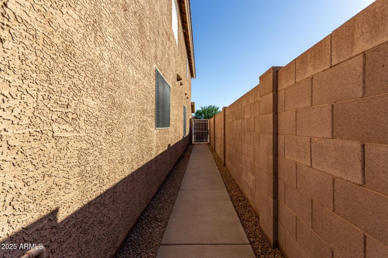 Walkway behind small gate