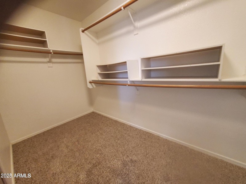 Walk in closet primary bedroom
