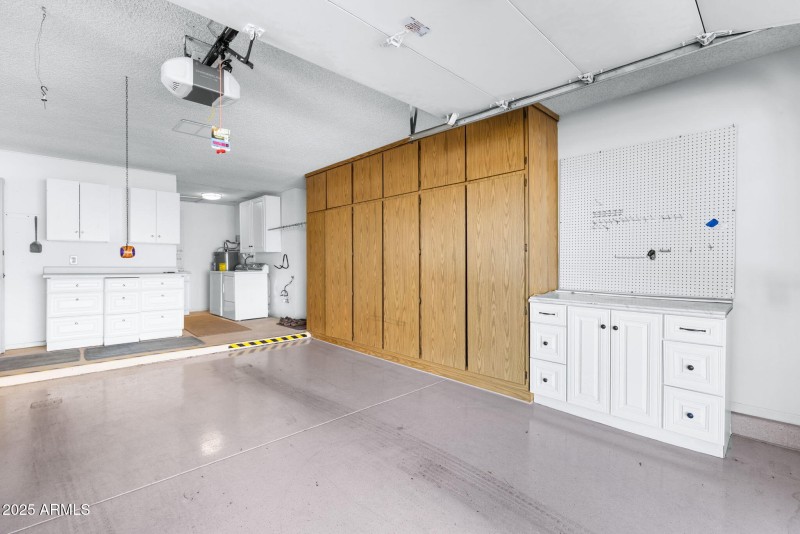 oversized garage with lots of white extr