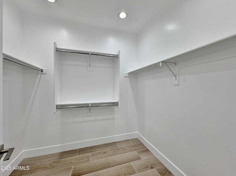 walk in closet with shelving
