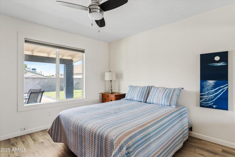 Secondary bedroom w/ backyard views