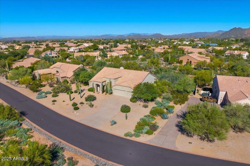 Home surrounded by lush desert
