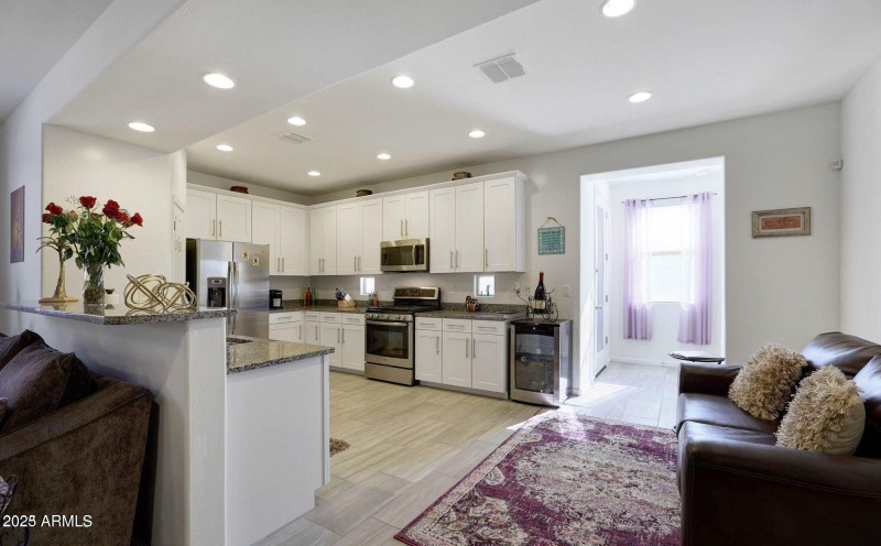 Spacious Kitchen With White Cabinets