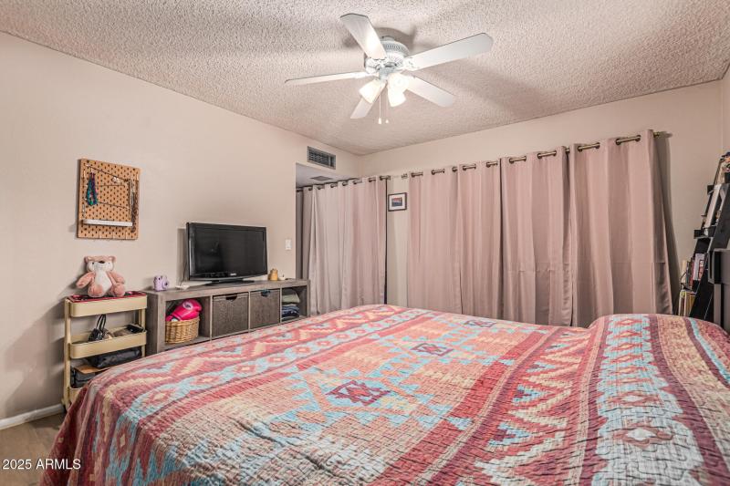 Master bedroom w/closet (drapes)