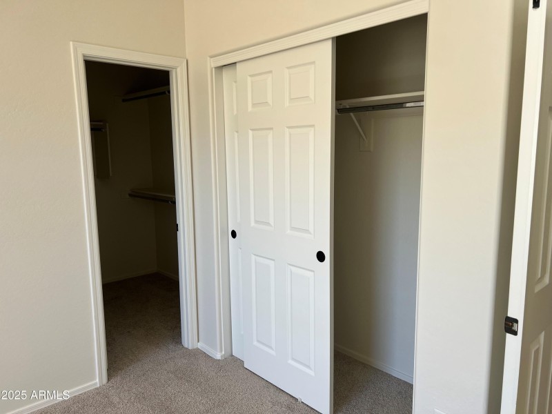 master bedroom with 2 closets