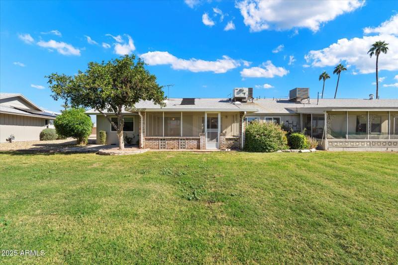 Back View of Home with Lush Landscaping