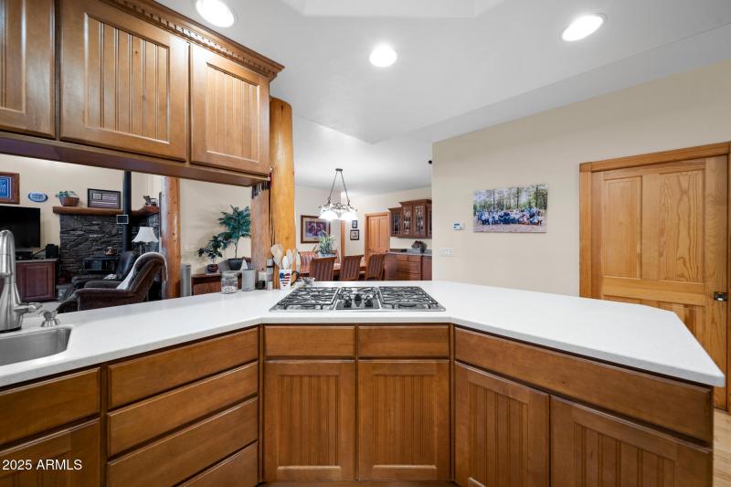 F view of gas stove top into dining room
