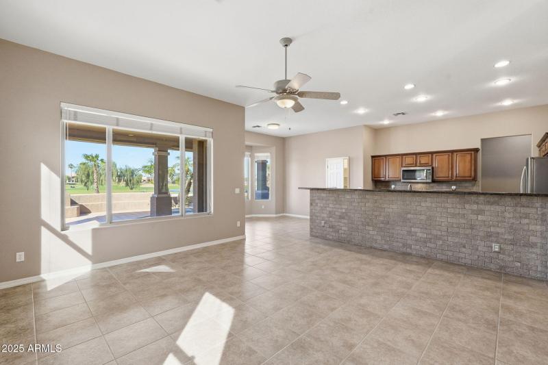 living room, dining area and eat up bar