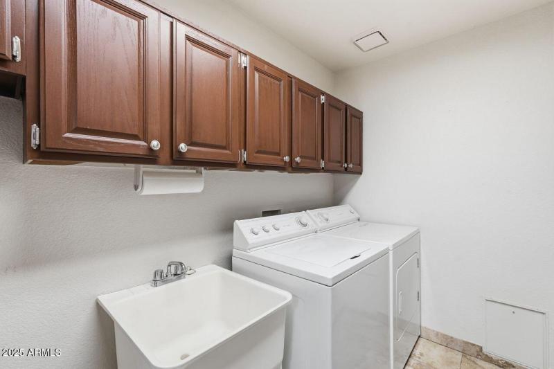 Inside Laundry w/storage & utility sink