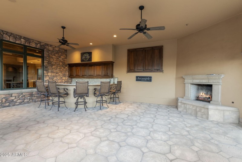 Covered Patio with a fireplace
