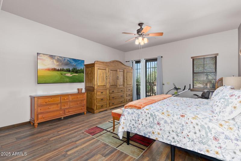 Primary bedroom has patio