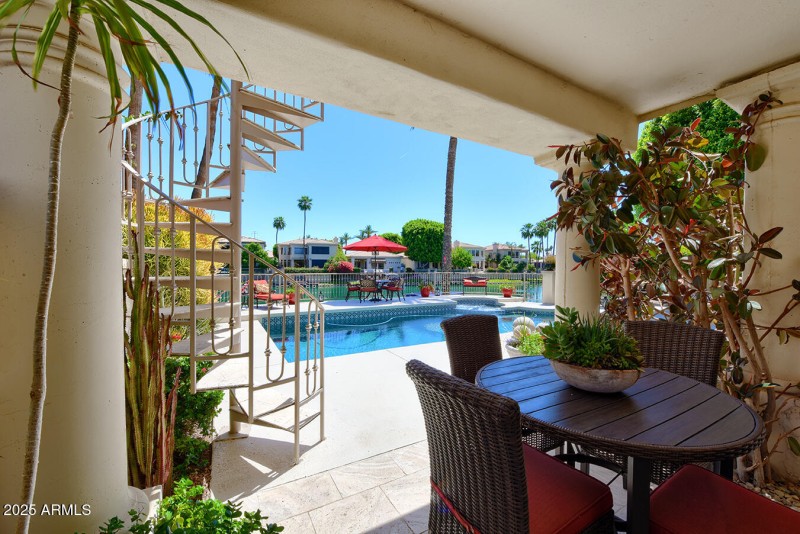 COVERED PATIO UNDER BALCONY STAIRWAY