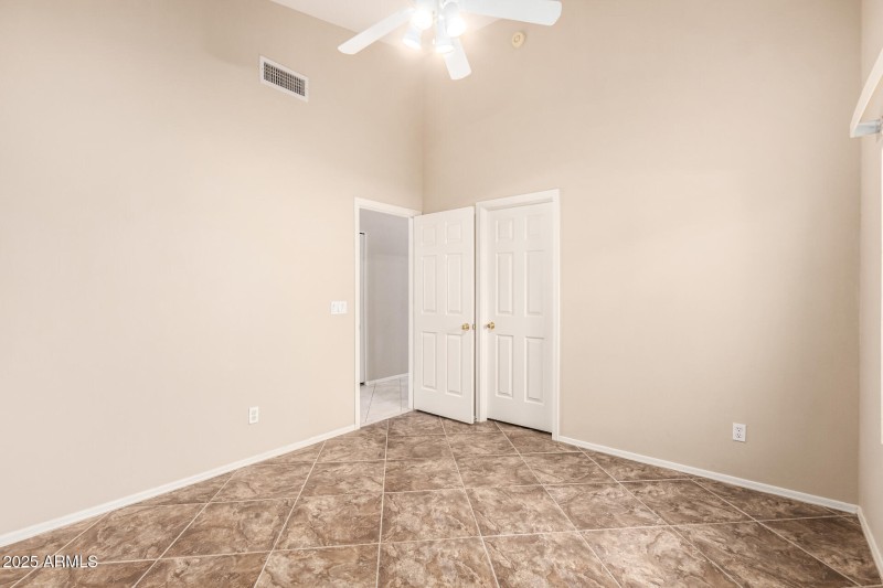 Secondary bedroom with walk in closet