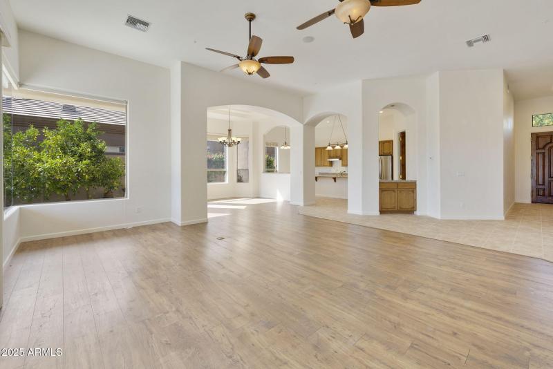 VIEW INTO FORMAL DINING AND KITCHEN