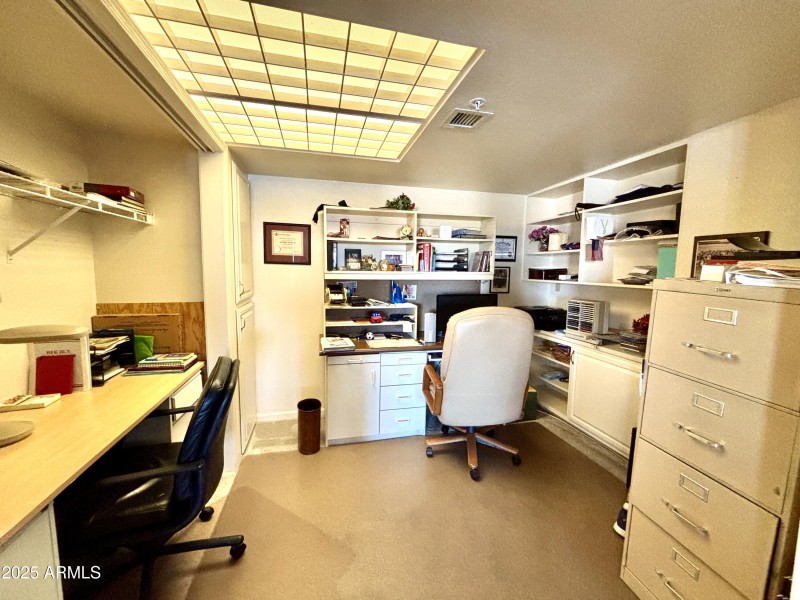 Spacious den with built in shelves