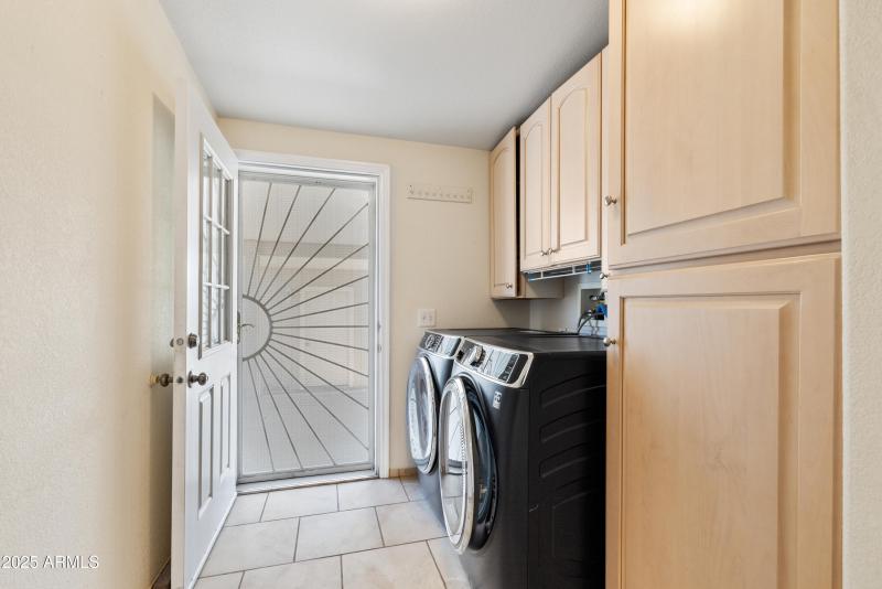 Laundry Room with storage cabinets
