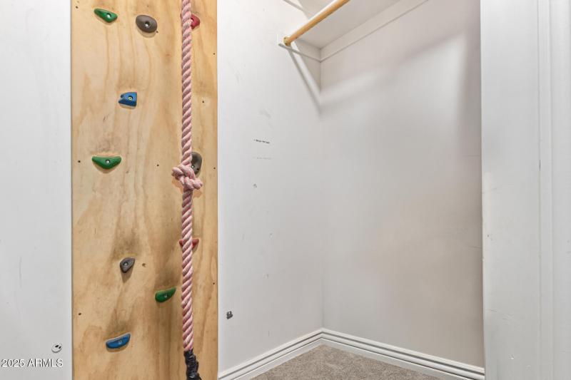 Rock wall up to a hidden loft play room