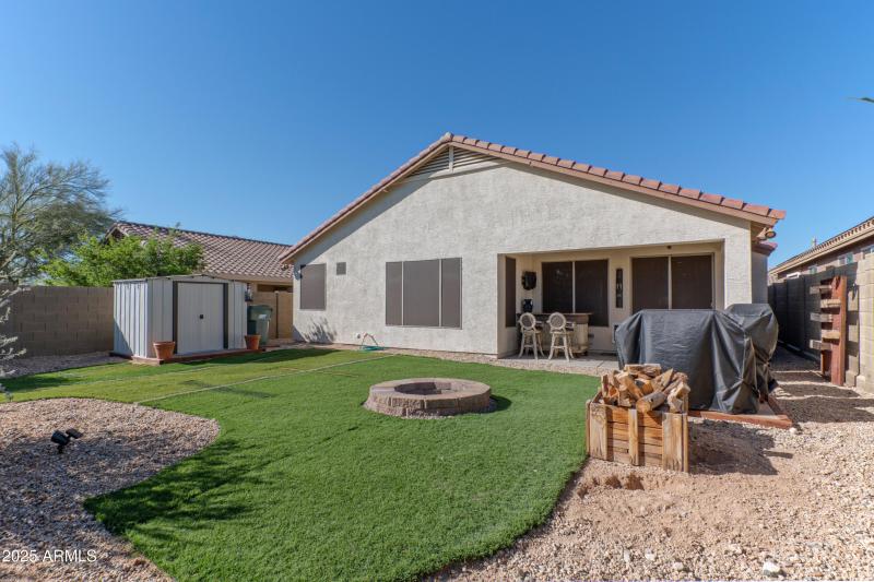 Easy care backyard with firepit