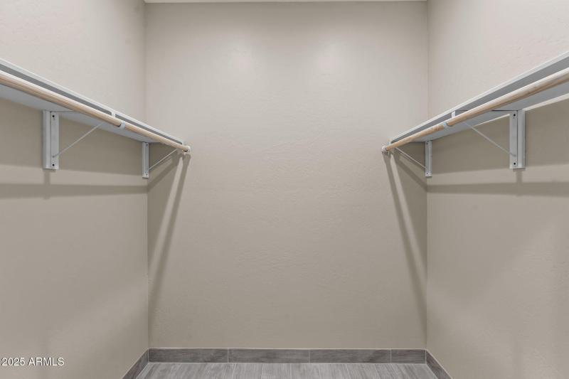 One of 2 primary walk-in closets